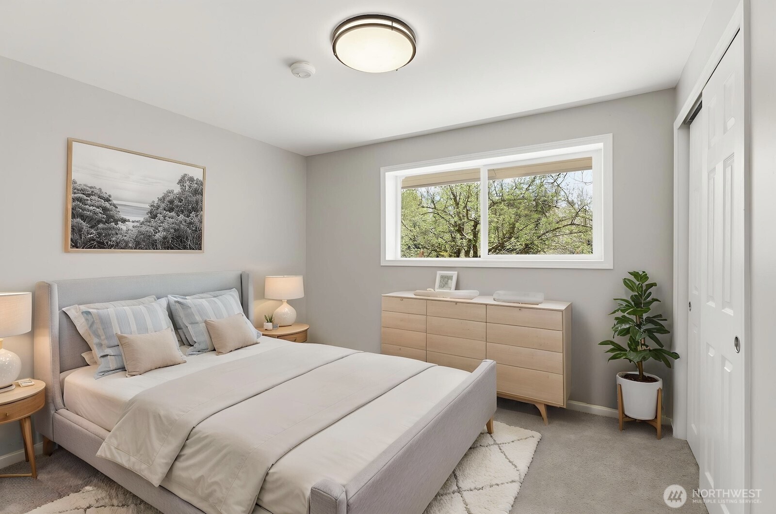 11617 Fay Road Northeast Carnation, WA 98014 - Photo 19 of 40 a bedroom with a large bed and a potted plant
