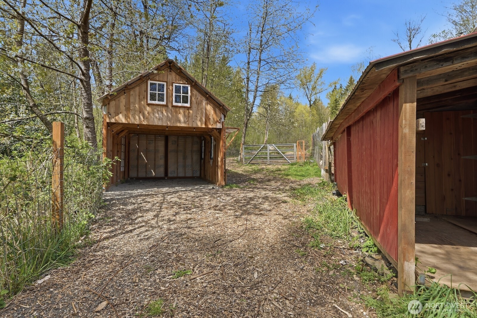 11617 Fay Road Northeast Carnation, WA 98014 - Photo 31 of 40 a view of a house with a yard and garage