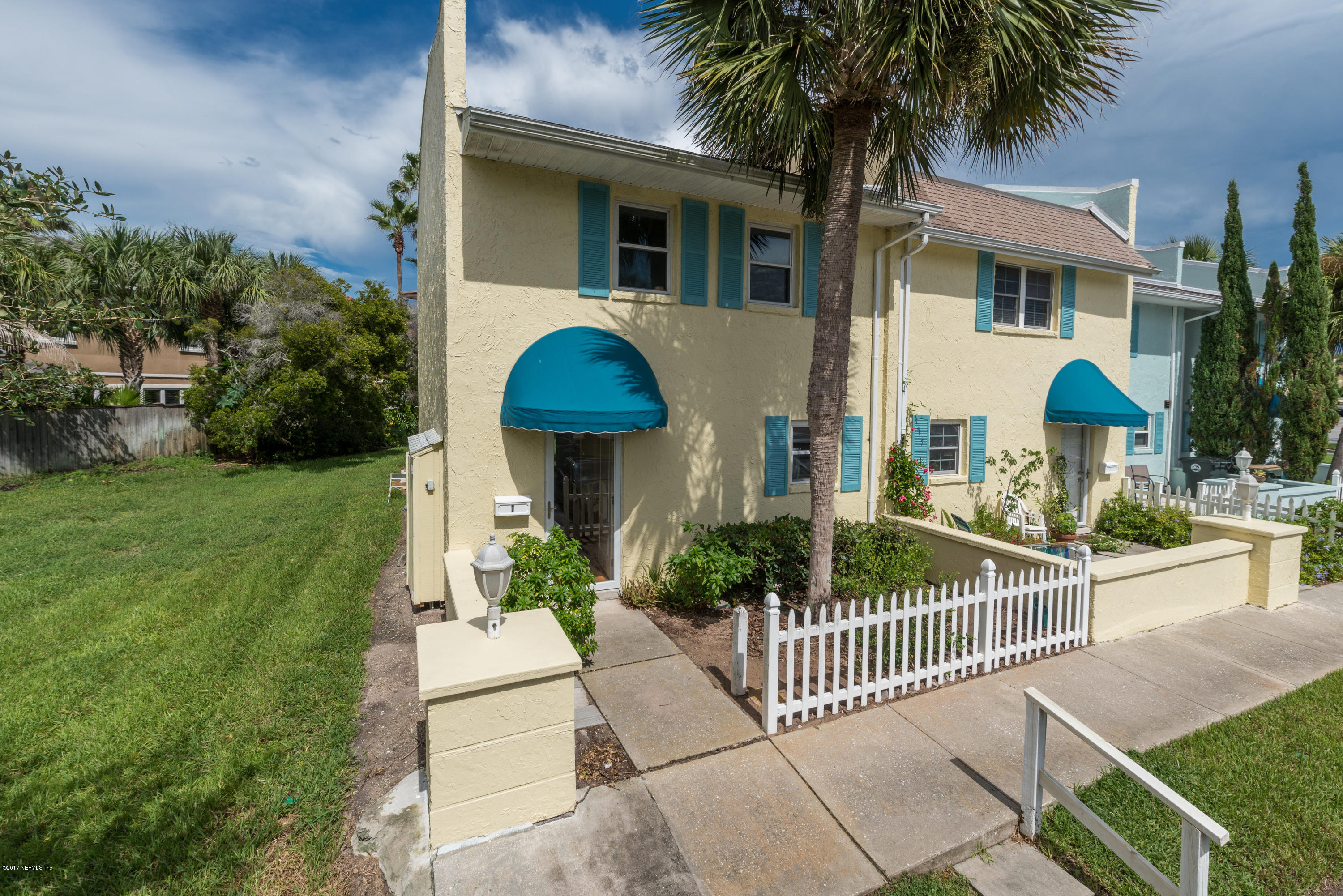 2233 Seminole Road, Unit 1 Atlantic Beach, FL 32233 - Photo 1 of 35 a front view of house with yard and green space