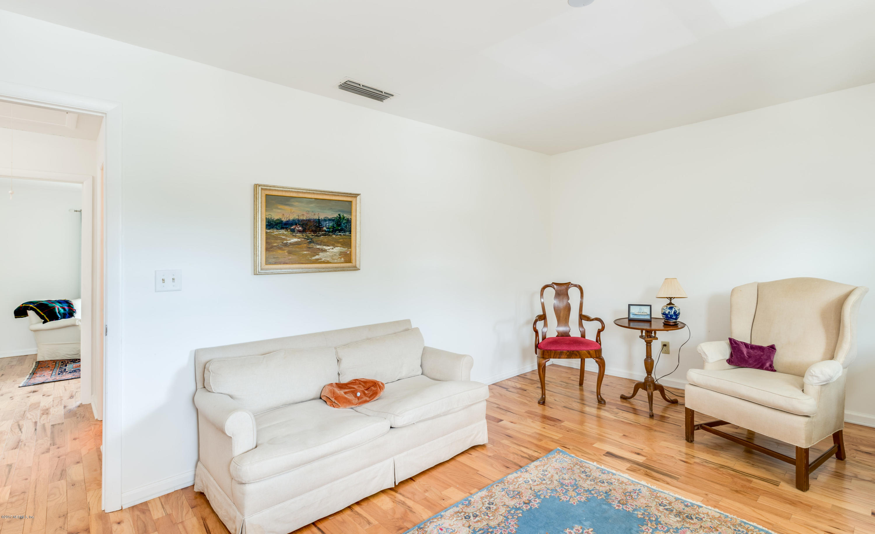 2233 Seminole Road, Unit 1 Atlantic Beach, FL 32233 - Photo 13 of 35 a living room with furniture and wooden floor