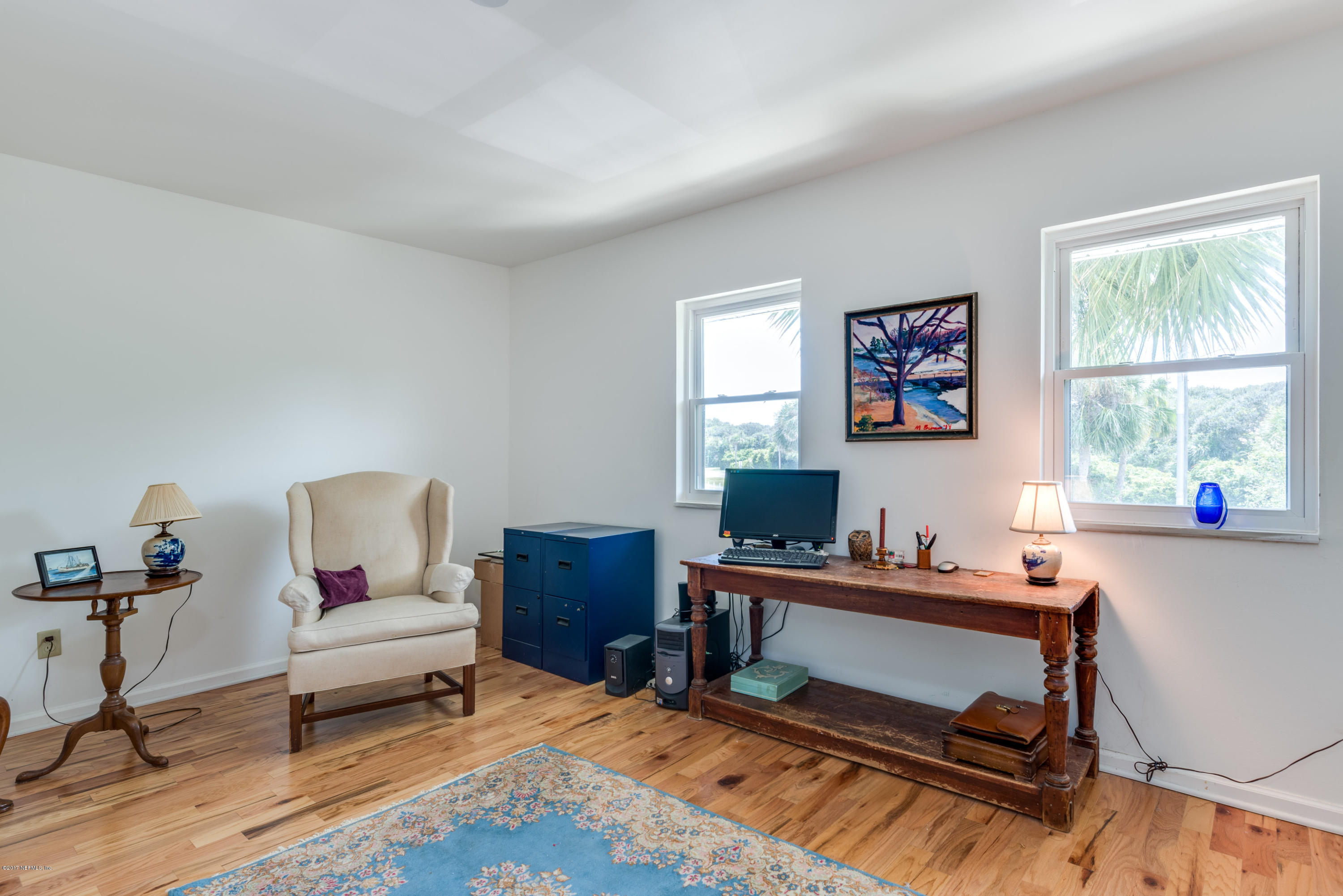 2233 Seminole Road, Unit 1 Atlantic Beach, FL 32233 - Photo 14 of 35 a living room with furniture a rug and a window
