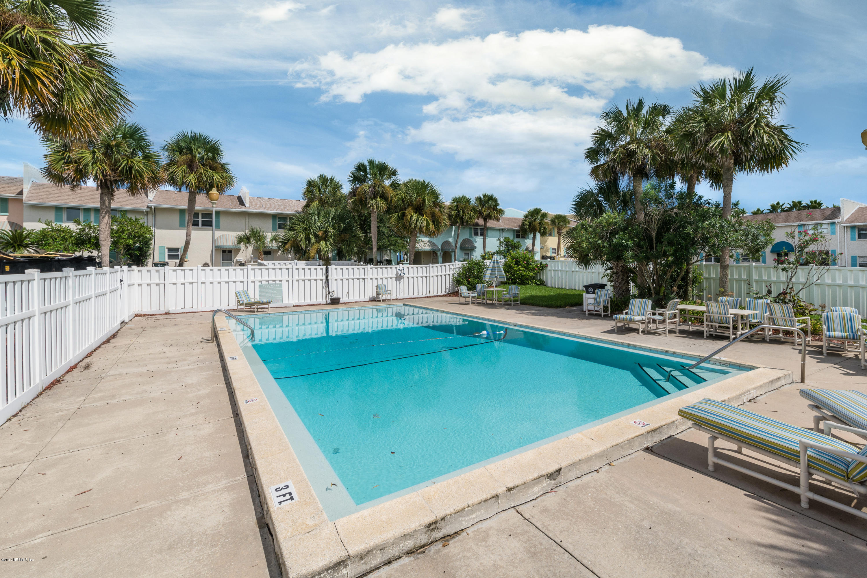 2233 Seminole Road, Unit 1 Atlantic Beach, FL 32233 - Photo 18 of 35 a view of a swimming pool with a lounge chairs