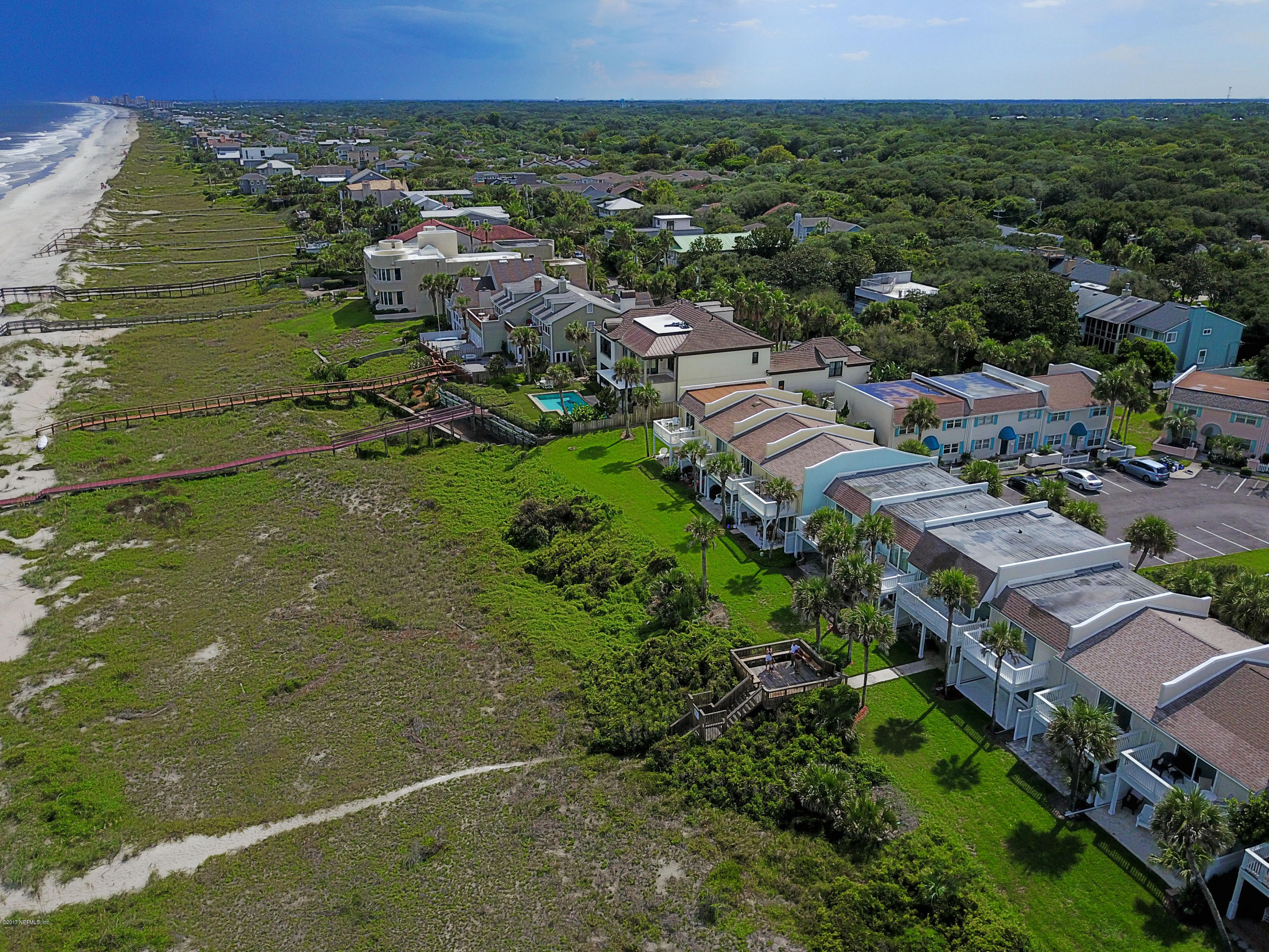 2233 Seminole Road, Unit 1 Atlantic Beach, FL 32233 - Photo 25 of 35 an aerial view of residential houses with outdoor space and trees