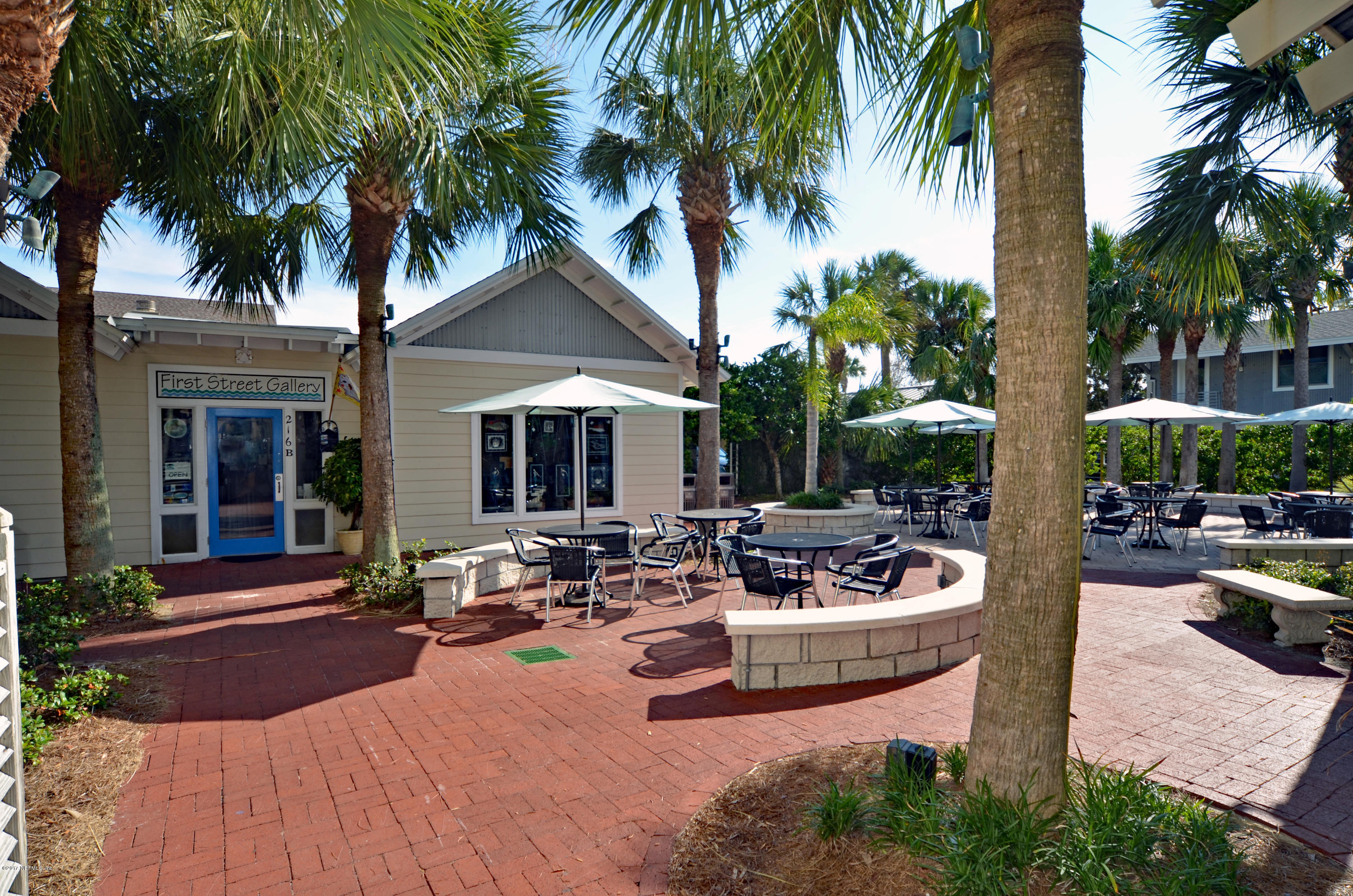 2233 Seminole Road, Unit 1 Atlantic Beach, FL 32233 - Photo 31 of 35 a view of a backyard with a patio and swimming pool