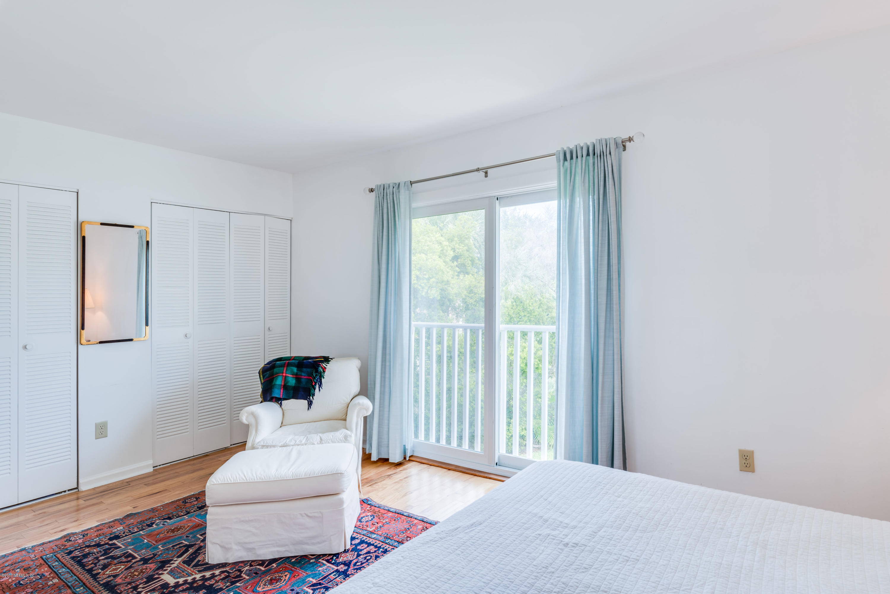 2233 Seminole Road, Unit 1 Atlantic Beach, FL 32233 - Photo 10 of 35 a bedroom with a bed and a window