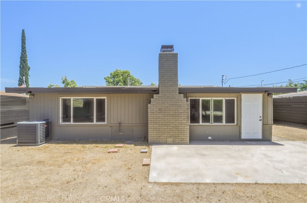 38859 Mesquite Road Palmdale, CA 93551 - Photo 35 of 36 a front view of a house with a yard and garage