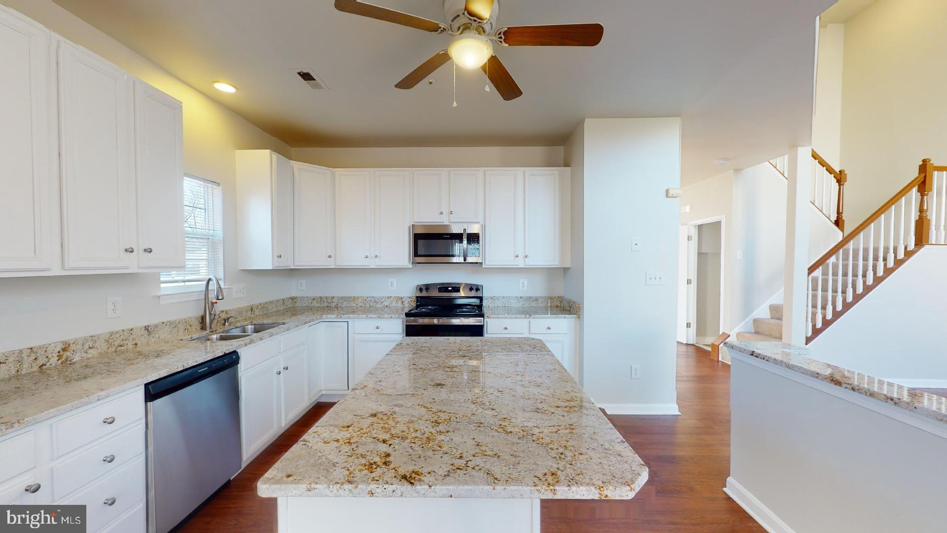 9418 Ardwick Ardmore Road Springdale, MD 20721 - Photo 19 of 56 Kitchen island with space for additional seating