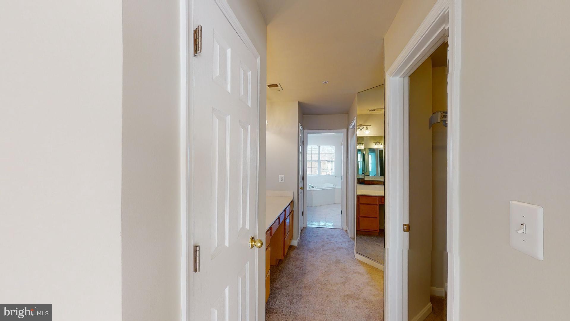 9418 Ardwick Ardmore Road Springdale, MD 20721 - Photo 37 of 56 Hallway leading to owner's bath