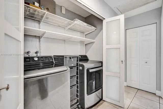 a kitchen with stainless steel appliances granite countertop a stove and a refrigerator