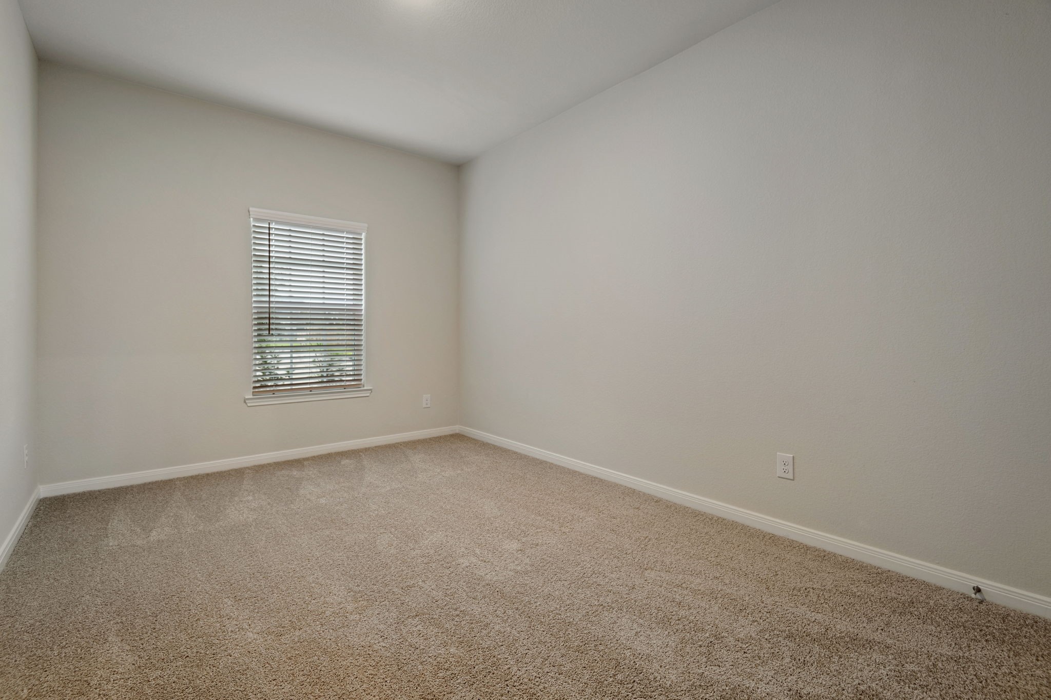 15434 Maple Ter Drive Conroe, TX 77303 - Photo 11 of 25 an empty room with windows