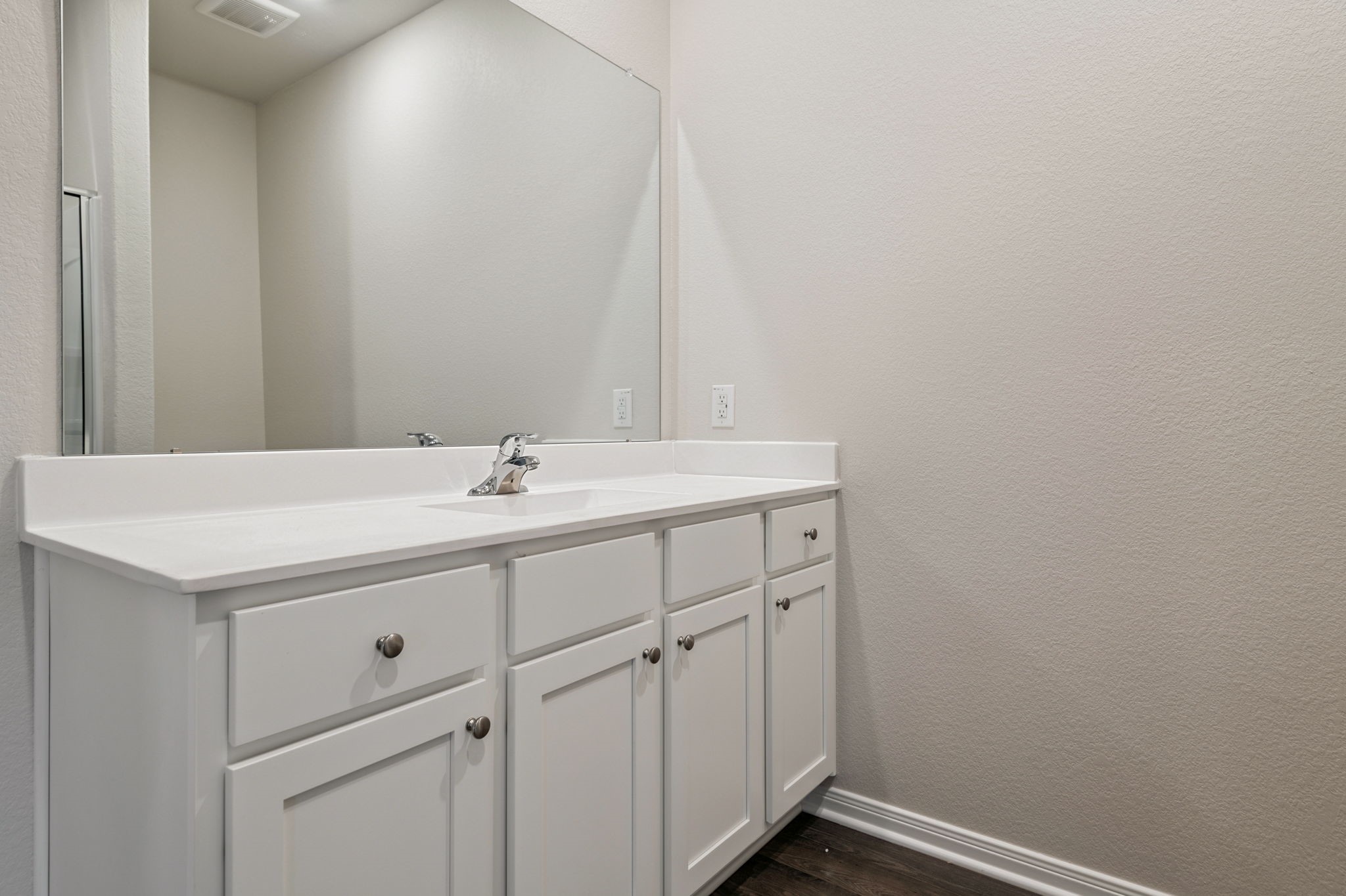 15434 Maple Ter Drive Conroe, TX 77303 - Photo 17 of 25 a bathroom with a sink vanity and a mirror