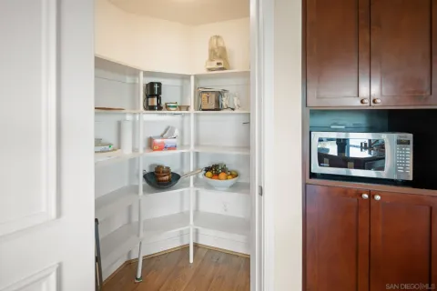 a view of kitchen and wooden floor