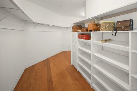 a view of storage and utility room with racks on the wall