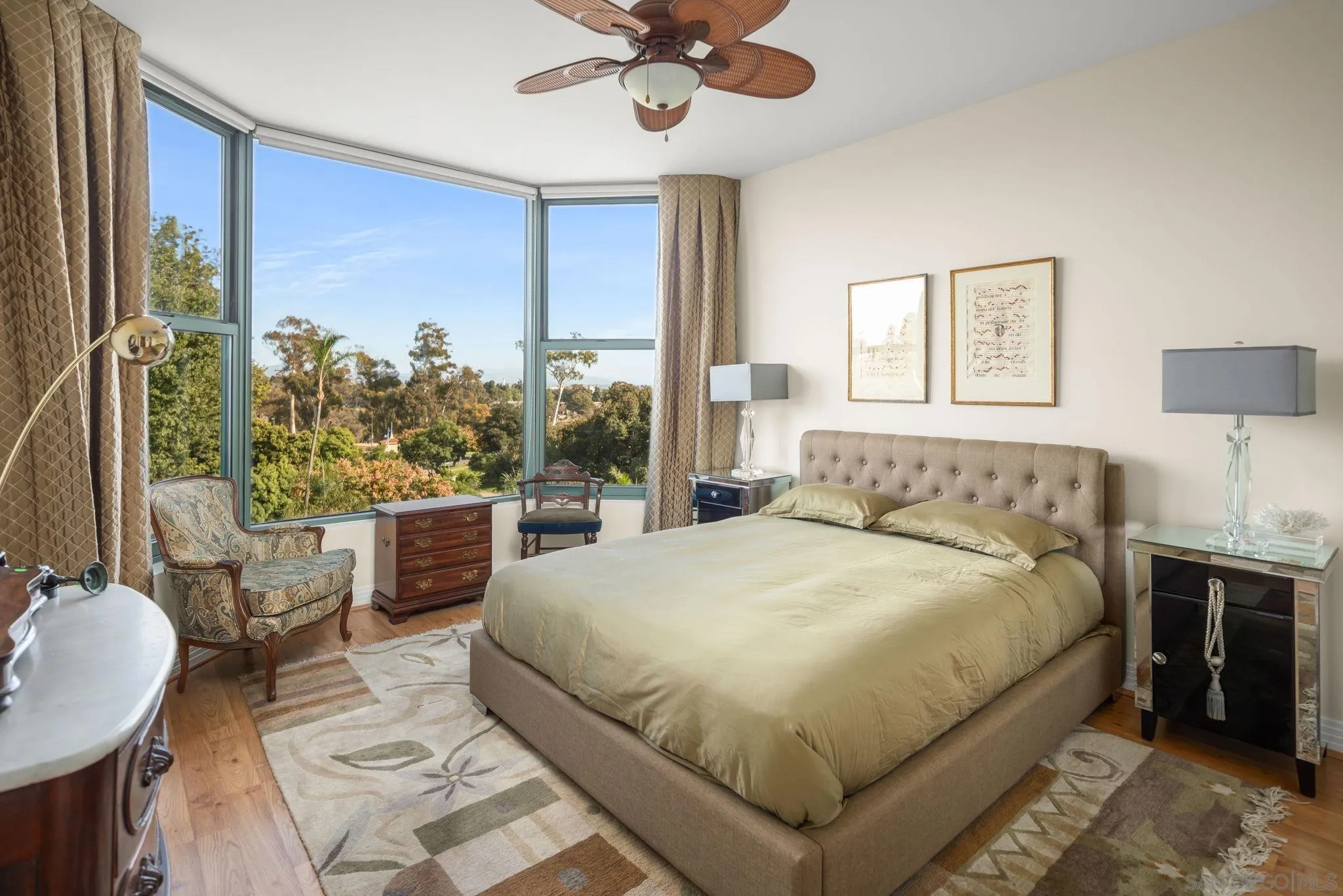 2500 Sixth Avenue, Unit 605 San Diego, CA 92103 - Photo 22 of 29 a bedroom with a large bed and a chandelier