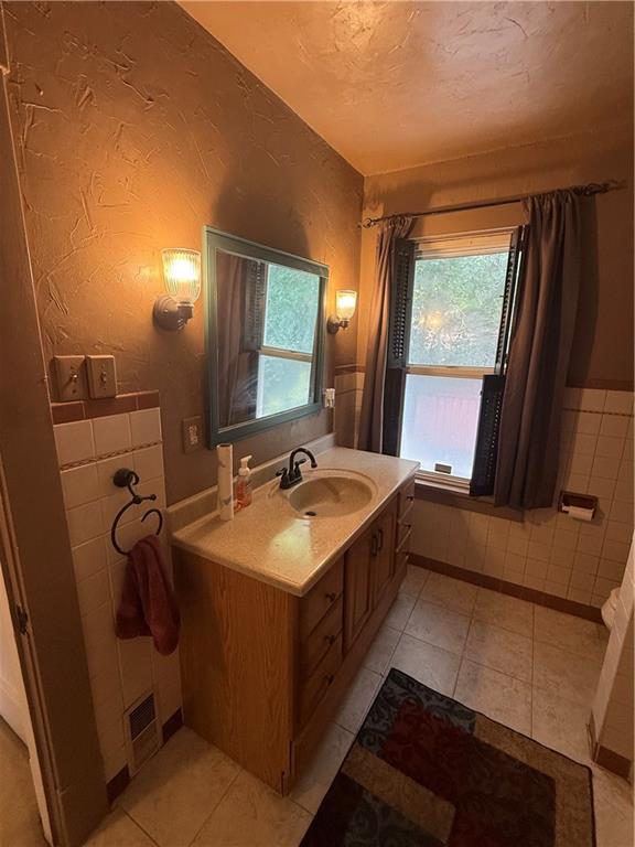433 Miller Avenue Butler, PA 16001 - Photo 22 of 29 a bathroom with a sink and a mirror