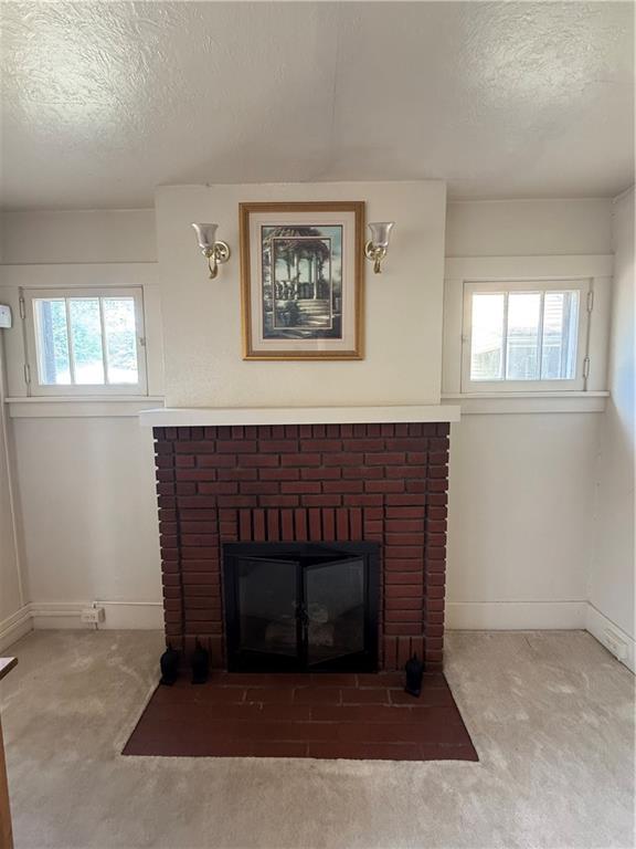 433 Miller Avenue Butler, PA 16001 - Photo 6 of 29 a living room with a fireplace and a window