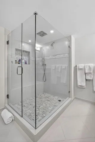 a view of a bathroom with a tub and large window
