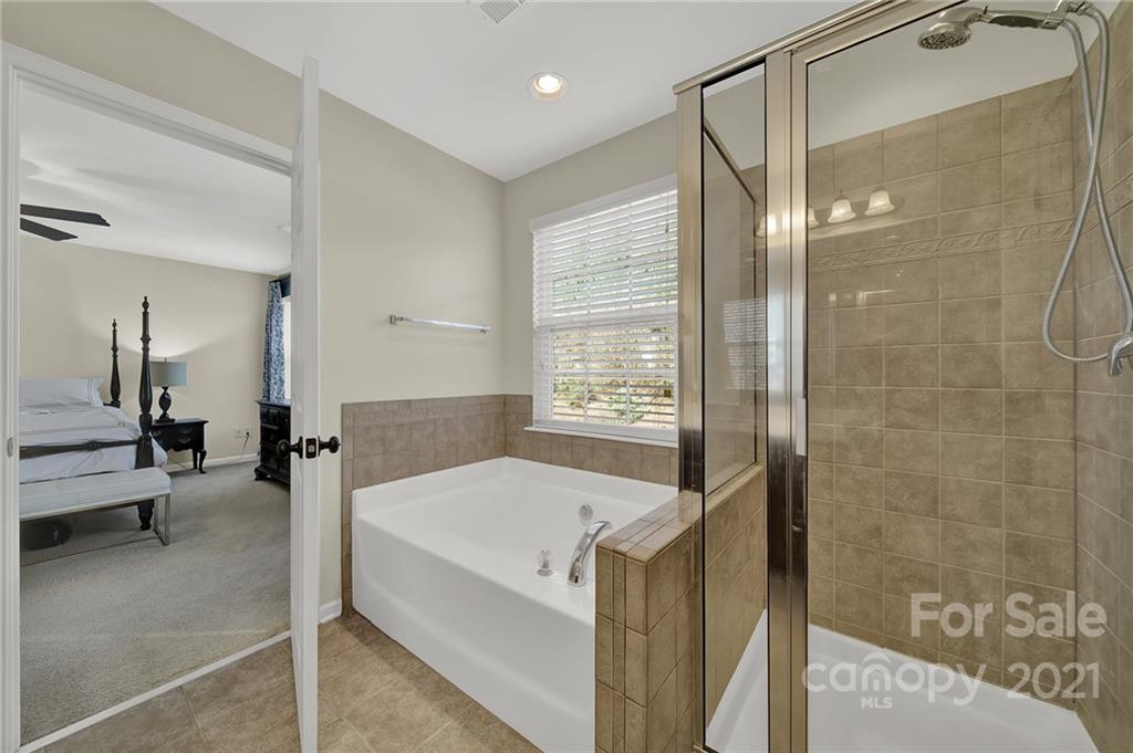 249 Fischer Road Fort Mill, SC 29715 - Photo 22 of 36 a spacious bathroom with a tub shower and sink