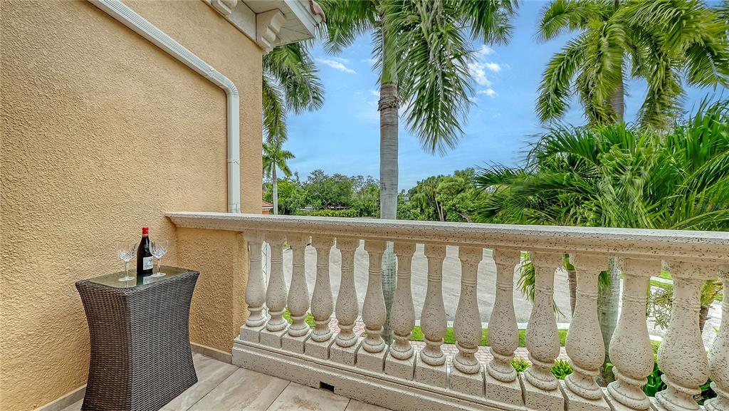 1630 Assisi Drive, Unit 18 Sarasota, FL 34231 - Photo 24 of 42 a view of a balcony with wooden floor