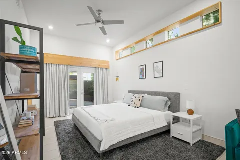 a bedroom with bed and window