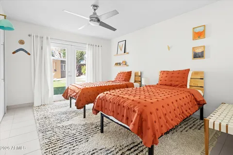 a view of a bathroom with a shower and a mirror