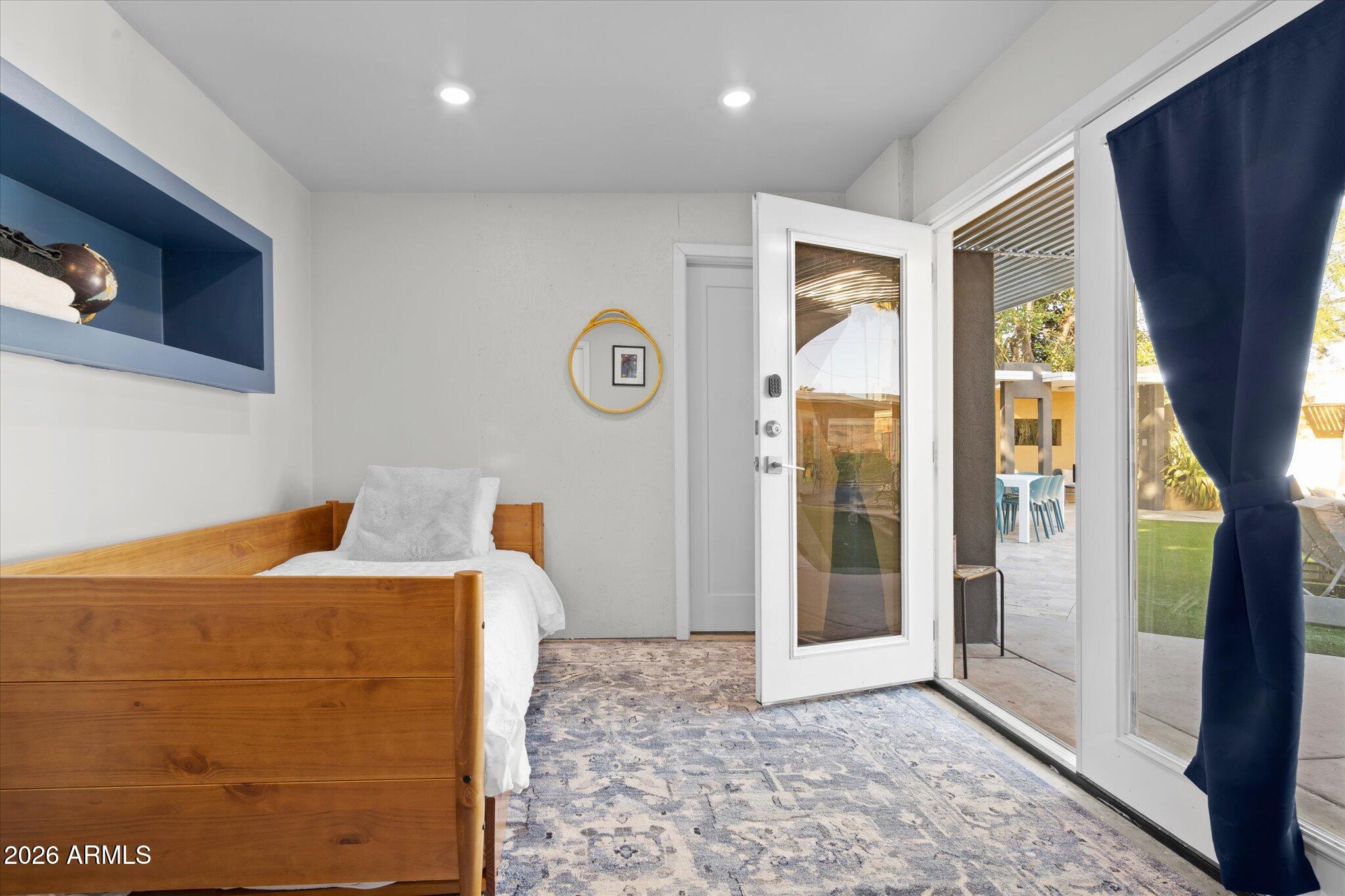 3812 East Coronado Road Phoenix, AZ 85008 - Photo 22 of 46 a view of a hallway with a door and wooden floor