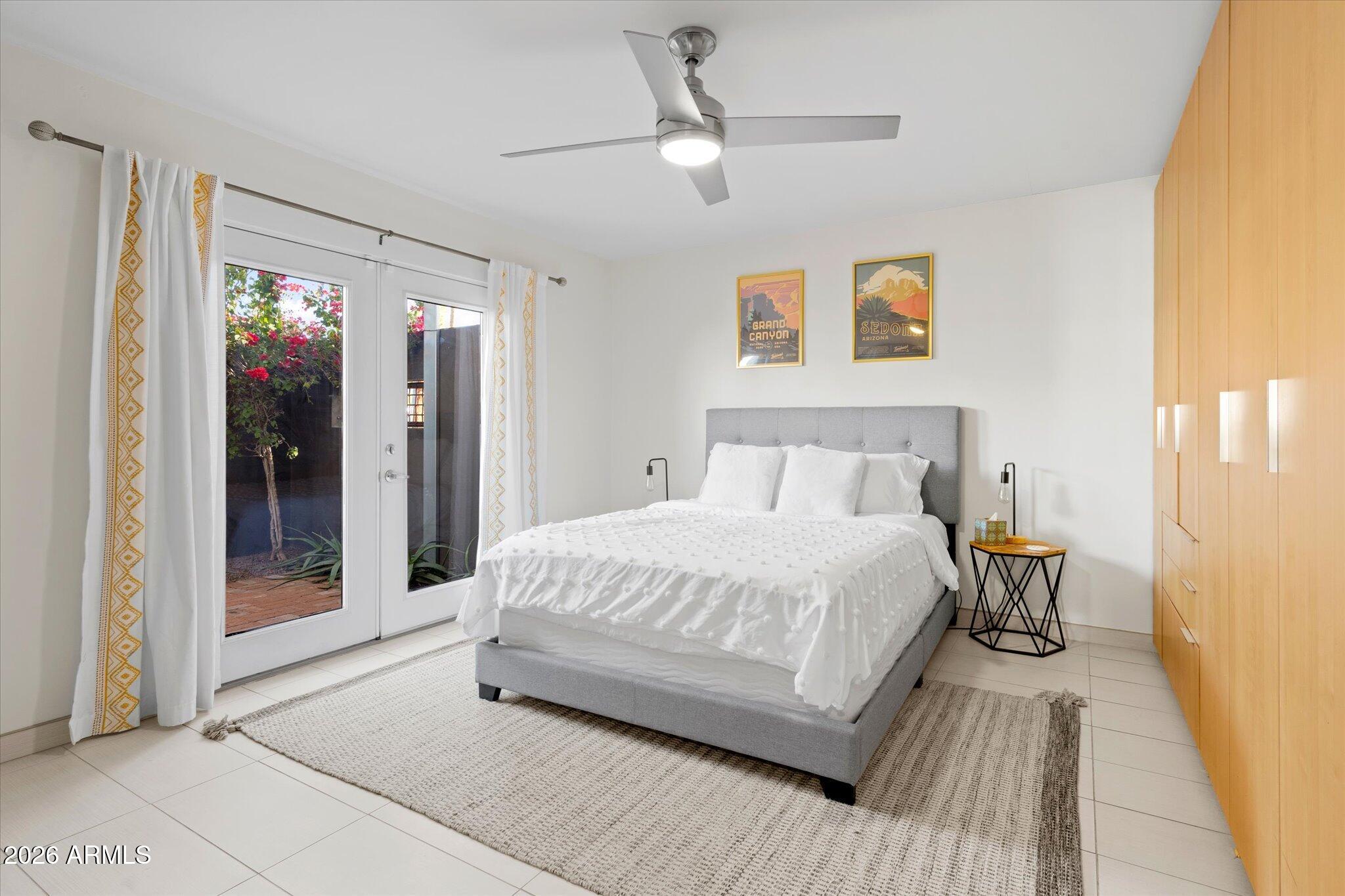 3812 East Coronado Road Phoenix, AZ 85008 - Photo 23 of 46 a spacious bedroom with a bed and a mirror