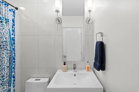 a bathroom with a bathtub and shower