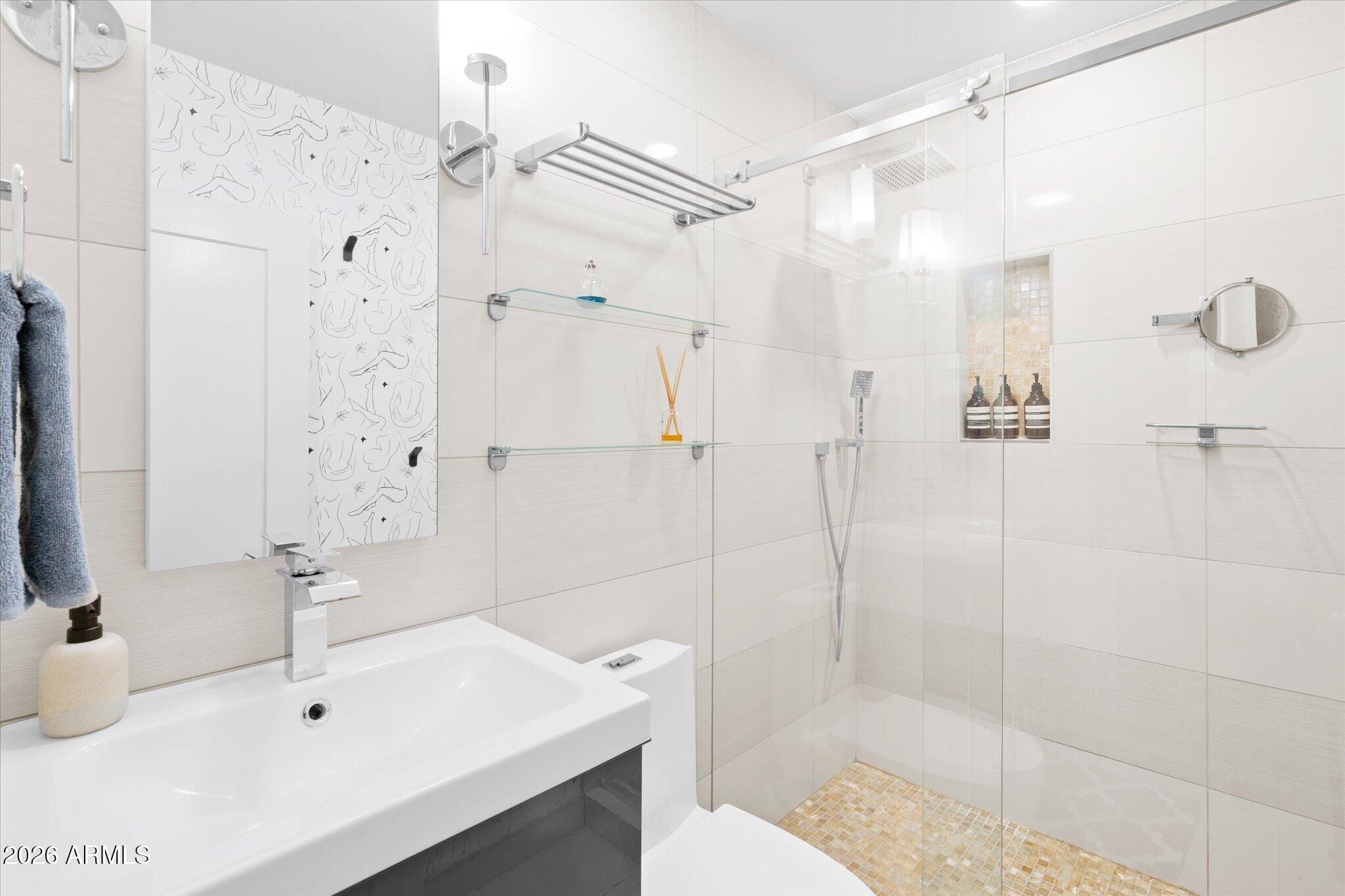 3812 East Coronado Road Phoenix, AZ 85008 - Photo 26 of 46 a bathroom with a sink a toilet and shower