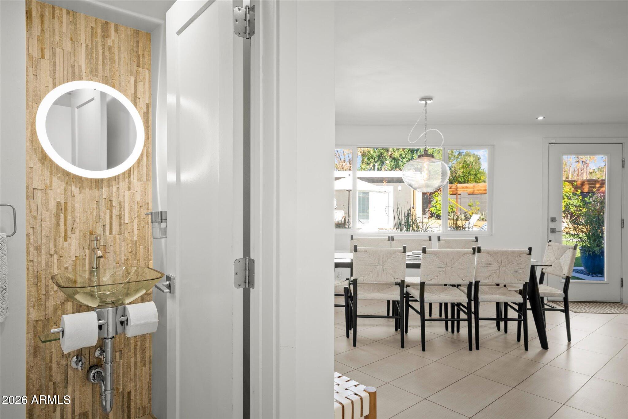 3812 East Coronado Road Phoenix, AZ 85008 - Photo 28 of 46 a view of a dining room with furniture and chandelier