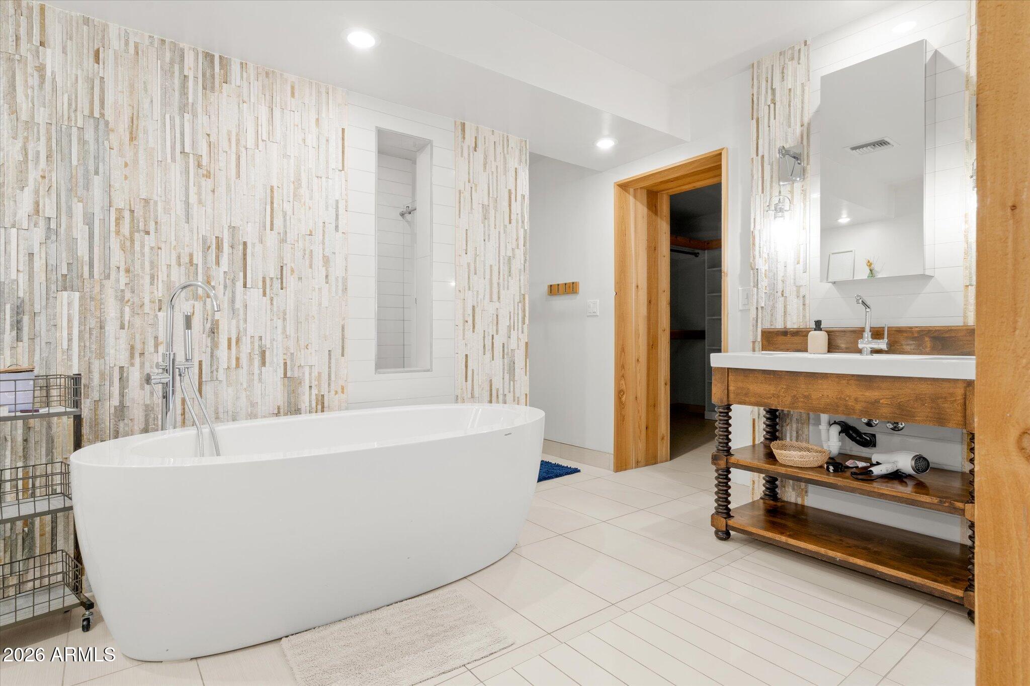3812 East Coronado Road Phoenix, AZ 85008 - Photo 29 of 46 a bathroom with a bathtub and a shower