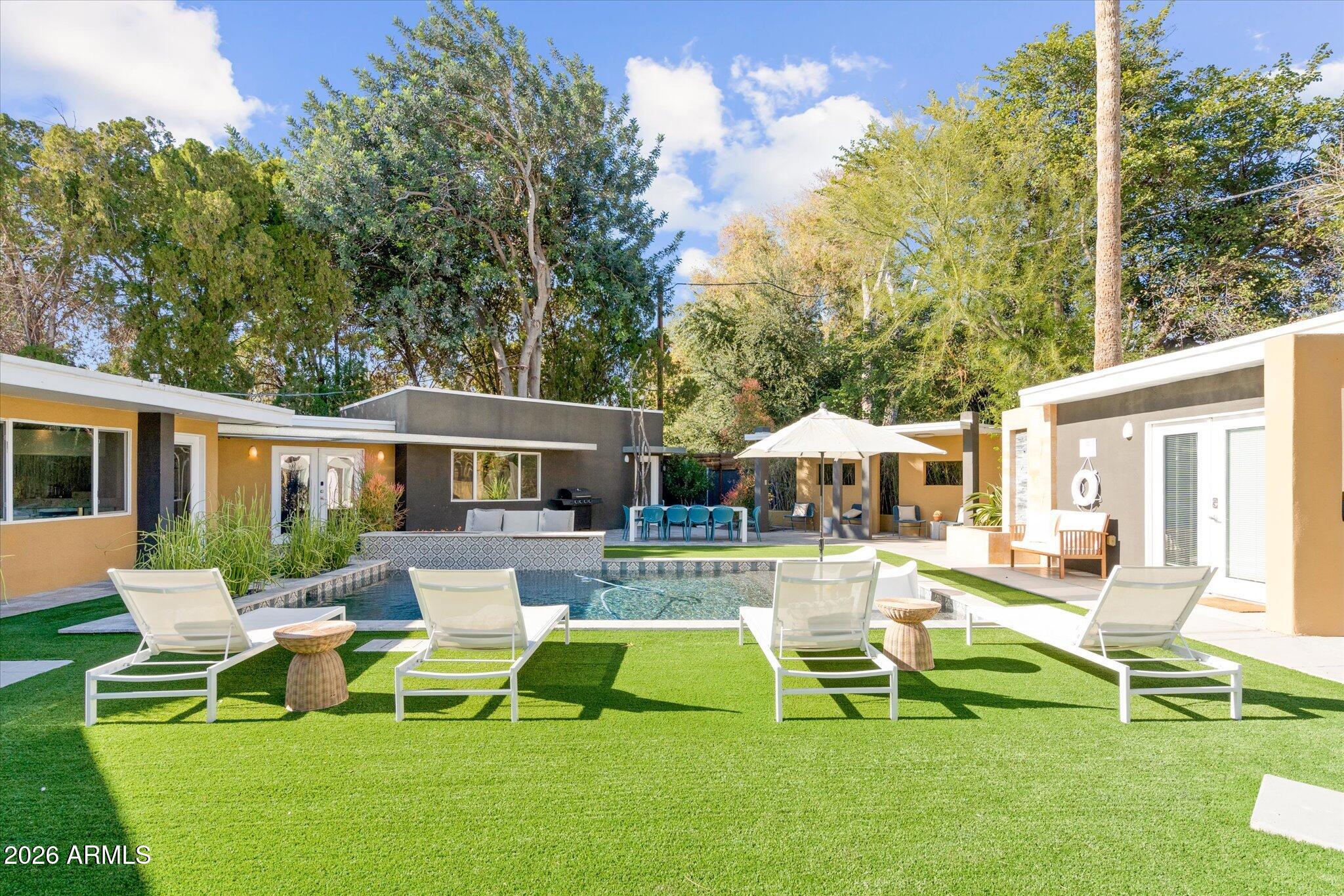 3812 East Coronado Road Phoenix, AZ 85008 - Photo 41 of 46 a view of a house with a yard patio and swimming pool