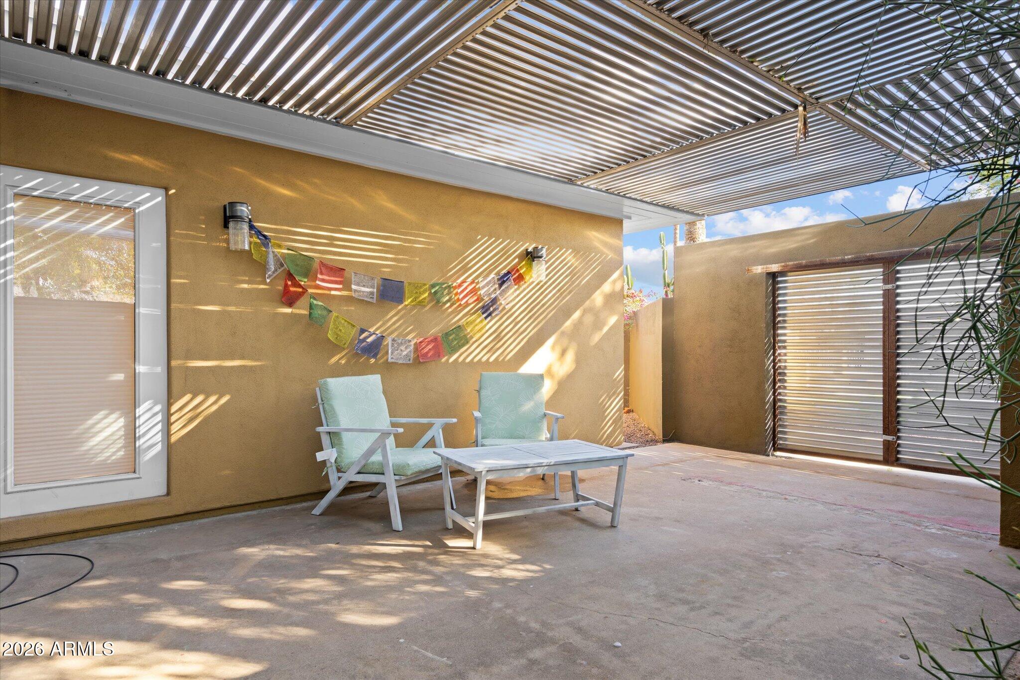 3812 East Coronado Road Phoenix, AZ 85008 - Photo 43 of 46 a view of a patio with table and chairs and potted plants