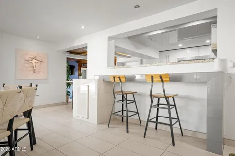 a kitchen with a stove a sink and a refrigerator