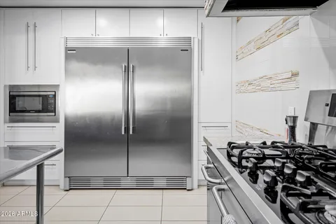 a view of a livingroom with furniture and staircase
