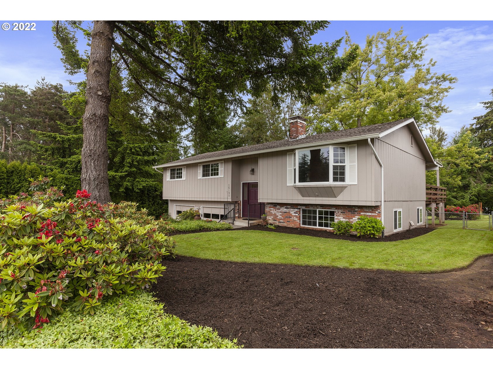 16190 South Wilson Road Oregon City, OR 97045 - Photo 2 of 32 a view of a backyard with plants and a garden