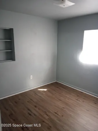 a kitchen with a sink a stove and cabinets