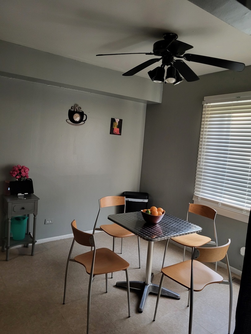 701 Spring Court, Unit 6 University Park, IL 60484 - Photo 2 of 6 a dining room with furniture and a window