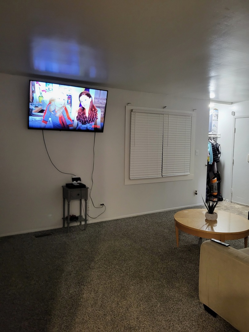 701 Spring Court, Unit 6 University Park, IL 60484 - Photo 4 of 6 a living room with furniture and a flat screen tv