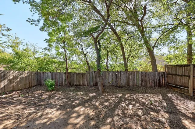 a view of outdoor space with deck and trees