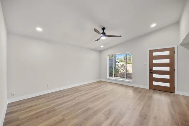 a kitchen with stainless steel appliances granite countertop a sink stove and microwave