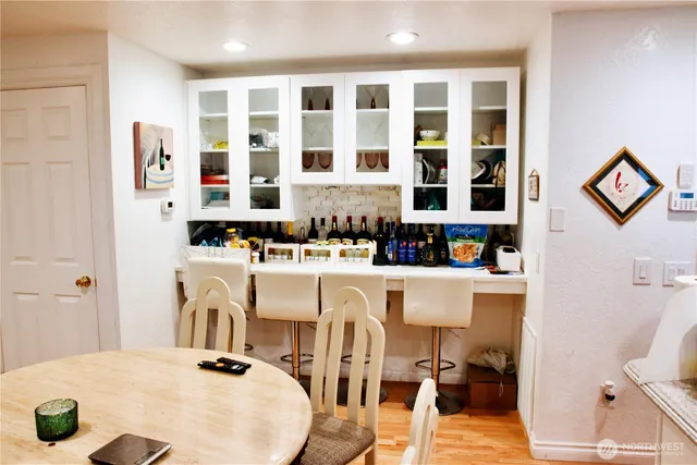 a very nice looking dining room with a table and chairs