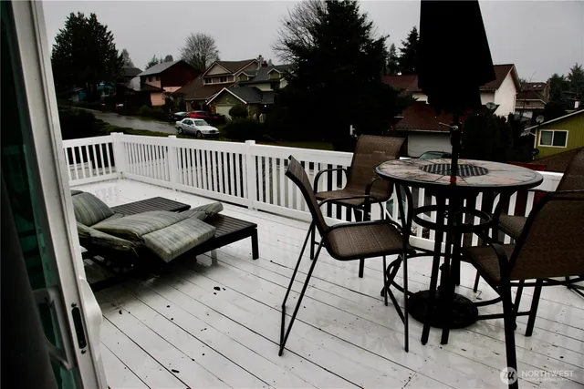 a view of a chairs and table in patio