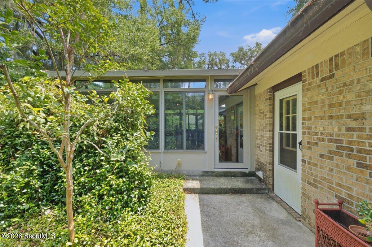 554 Old Plantation Road Jekyll Island, GA 31527 - Photo 45 of 58 backyard Sunroom entrance