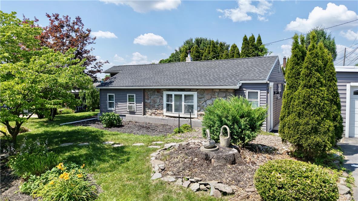 246 Poplar Street Bath, PA 18014 - Photo 3 of 34 A welcoming stone and siding facade offers charming curb appeal with mature landscaping.