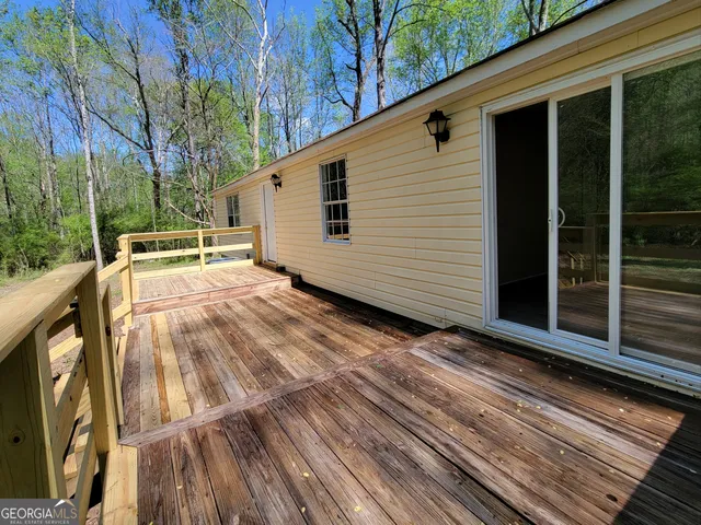 a view of a two chairs in the balcony