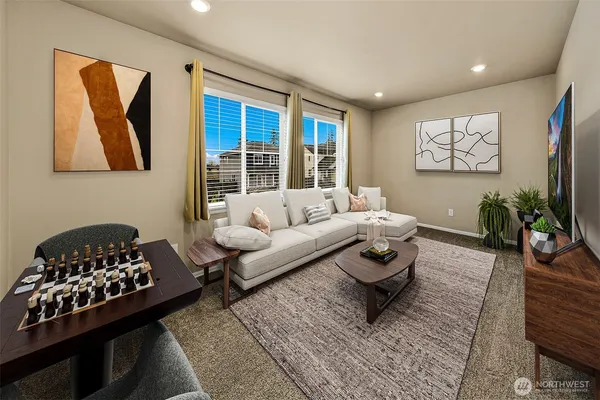 a living room with furniture and a rug