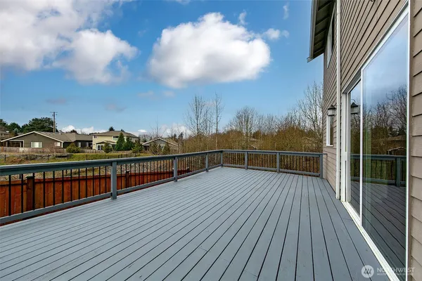 a view of balcony with wooden floor