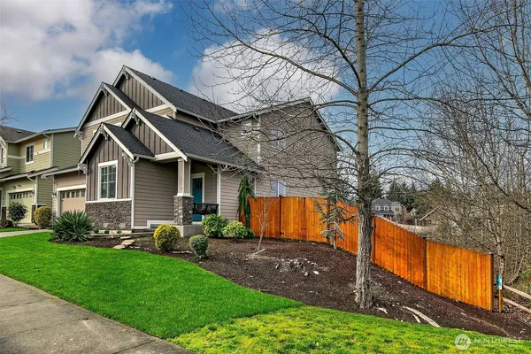 a front view of house with yard and green space