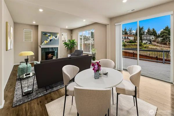 a dining room with furniture and window